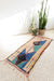 This vintage Moroccan rug runner (from Azilal region) is a true masterpiece. Its sophisticated design, minimal pattern, and unique color scheme (low key blue and green on a beige background) make it a standout piece that will add elegance and character to any space. The dimensions of the rug runner make it perfect for hallways, entryways or even as a decorative piece on a larger floor space. The rug could be hung on a wall just like an art tapestry.